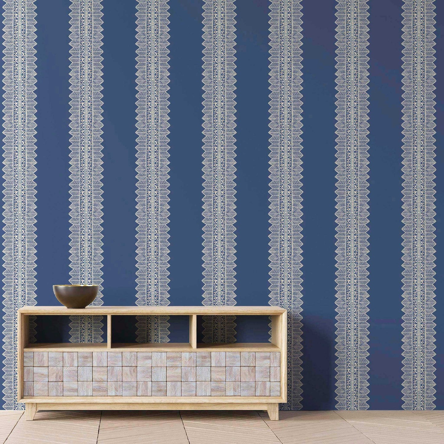 Lapis blue bohemian striped wallpaper in a creative living room with bold, artistic style and crisp white stripes