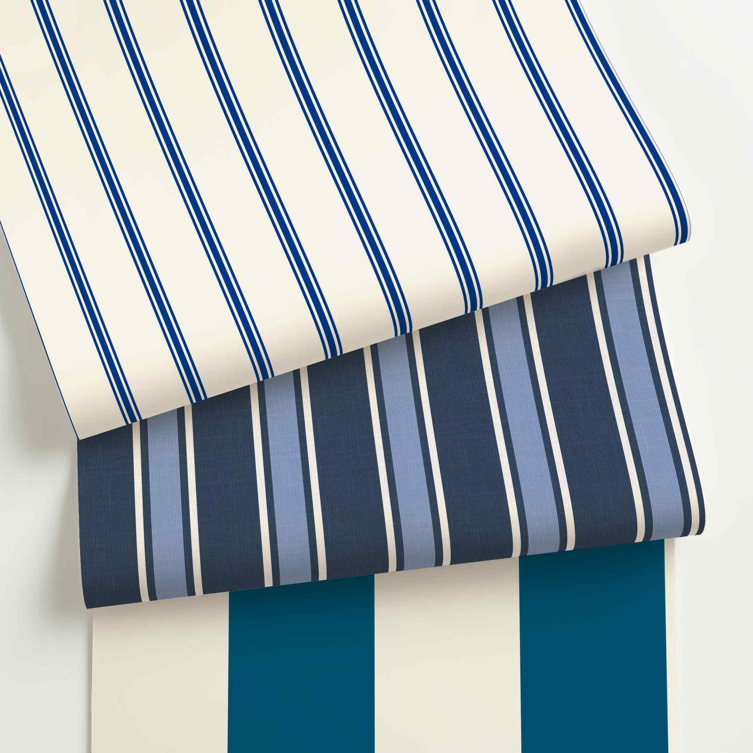 Blue and white striped wallpaper rolls in assorted colors, scales, and stripe patterns.
