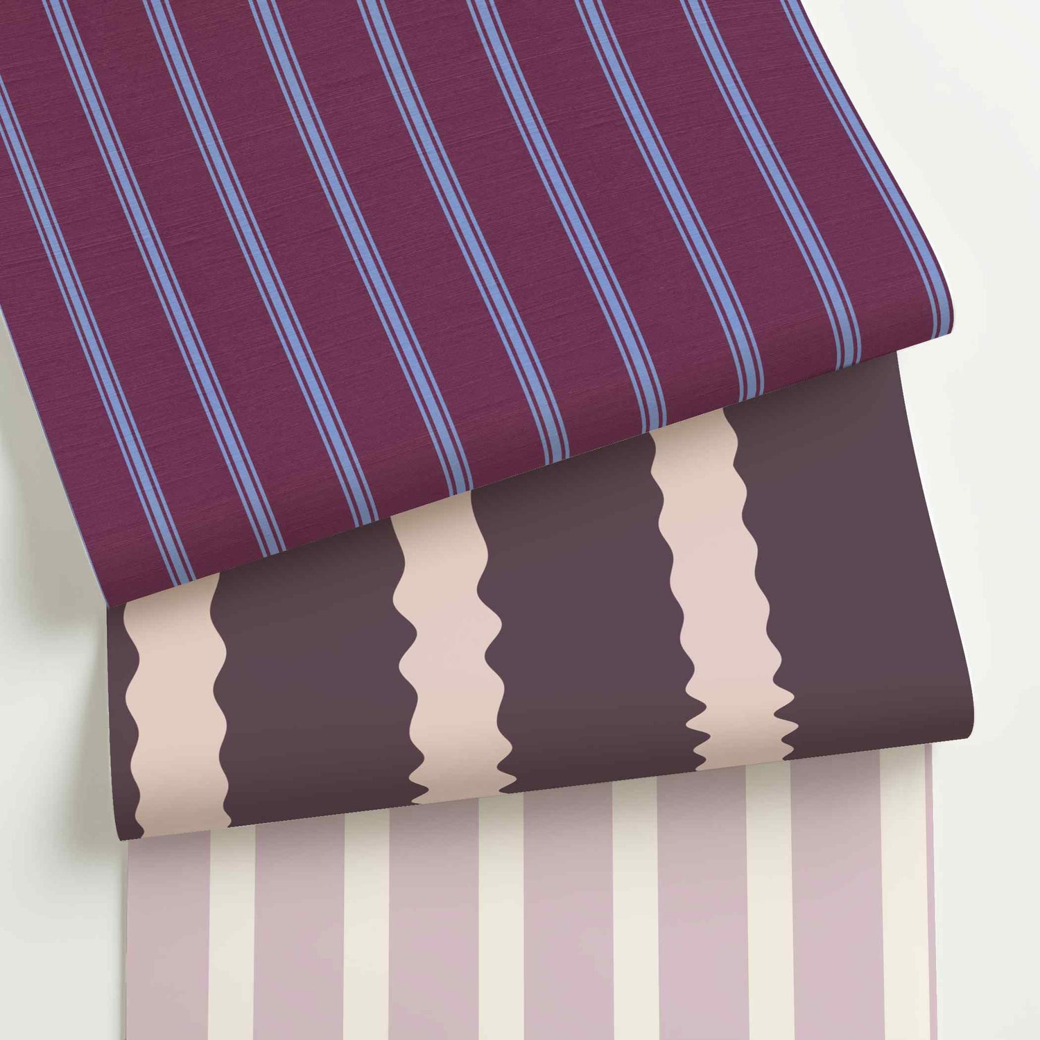 Lavender striped wallpaper rolls in assorted colors, scales, and stripe patterns.