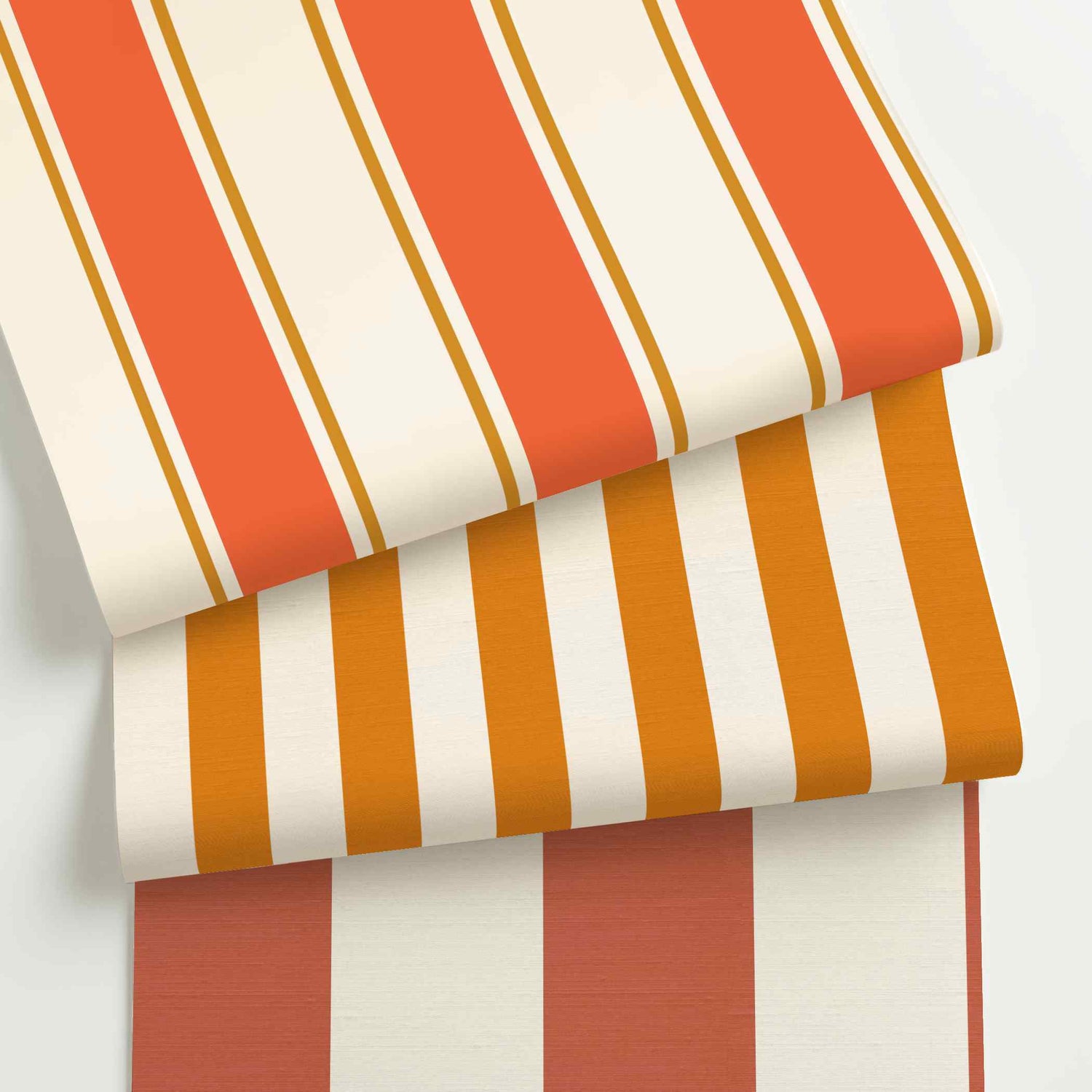Orange and white striped wallpaper rolls in assorted colors, scales, and stripe patterns.
