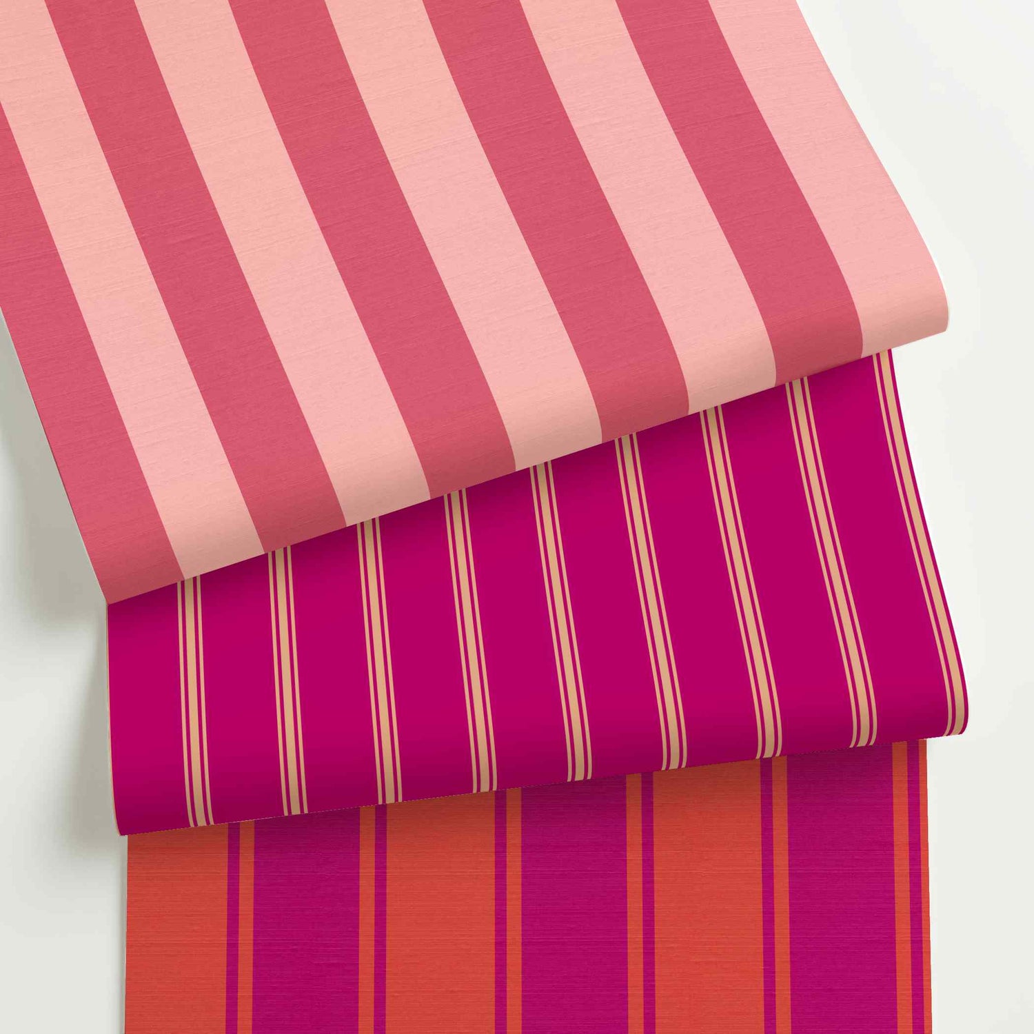 Hot pink striped wallpaper rolls in assorted colors, scales, and stripe patterns.