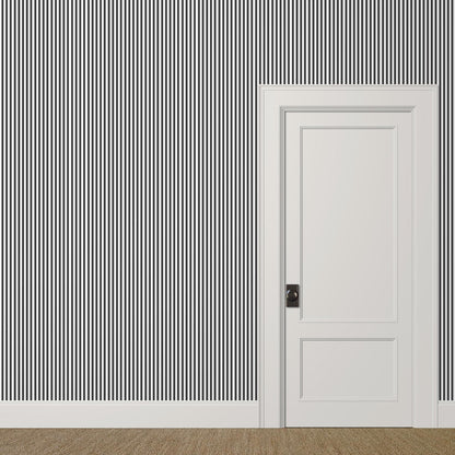 ½-inch black and white striped wallpaper in a bold stairwell for graphic effect