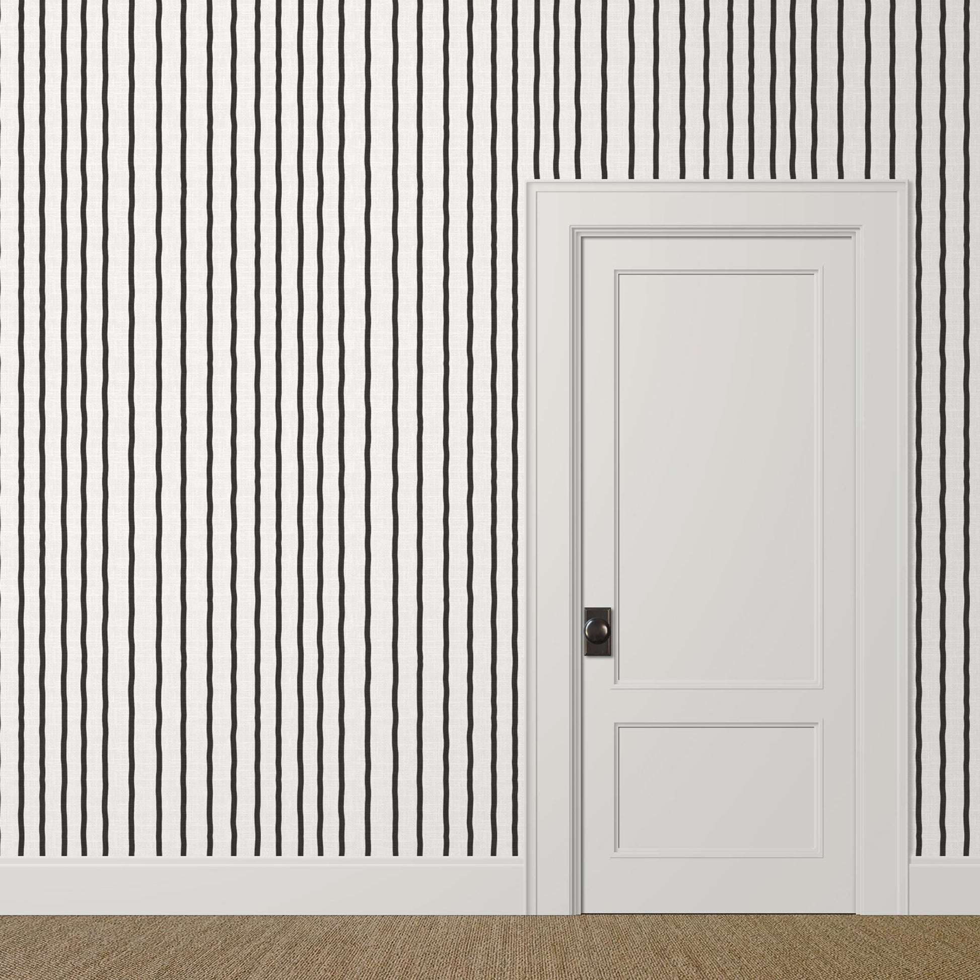Medium-scale black and white painted stripe wallpaper with linen finish in a modern bedroom