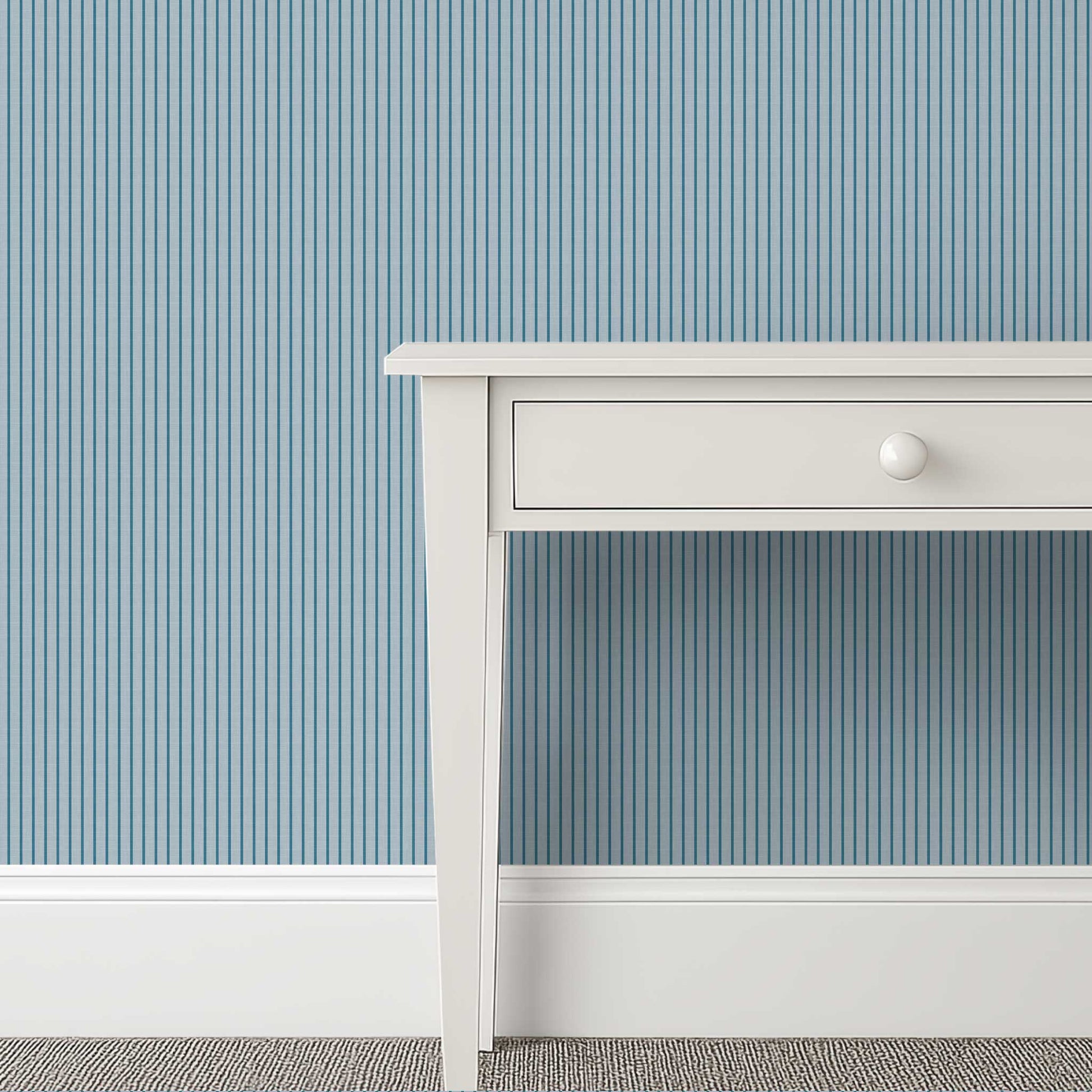 blue grey pinstripe wallpaper in a calm, refined bedroom interior