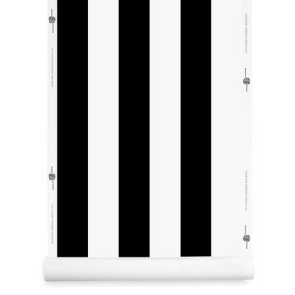 A roll of bold black and white striped wallpaper 
