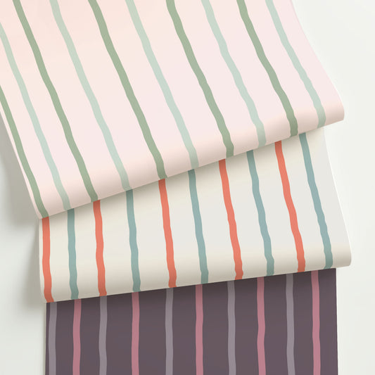 Three colorways of whimsical wavy stripe wallpaper with soft, hand-painted lines in pastel and earth tones—perfect for playful or artistic interiors.