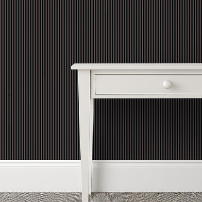 Small-scale black and grey striped wallpaper in a gentleman’s wardrobe with a tailored, masculine atmosphere