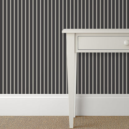 Moody soft black and cream ticking stripe wallpaper in a vintage-inspired bedroom – Lachman