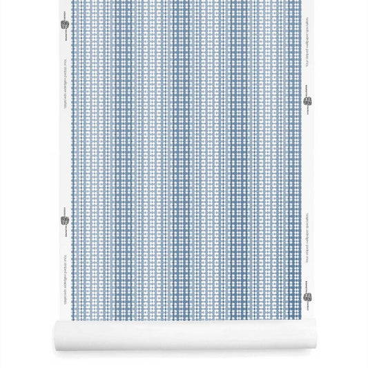 Roll of dusty blue ombre wallpaper with stripes, hand-dyed style and soft geometric contrast.