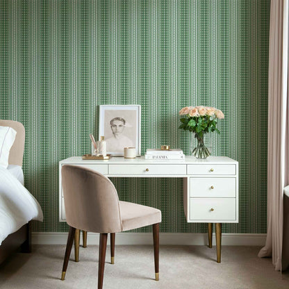 Fern green ombre wallpaper with stripes shown in a modern bedroom with minimal furnishings.