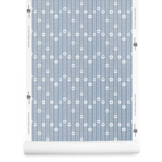 Dusty blue mudcloth-style wallpaper roll featuring small tribal-inspired stripe