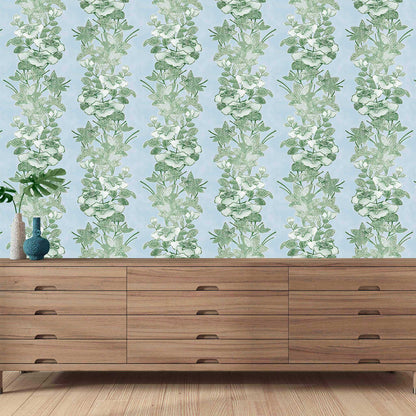 green striped floral wallpaper in airy bedroom with natural wood tones