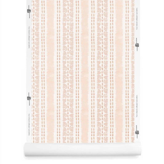 Artistic wallpaper roll in blush pink featuring organic watercolor stripe detailing